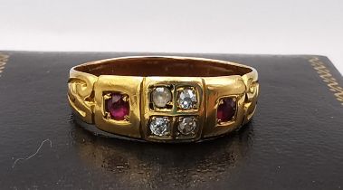 An early 20th century yellow and pink metal carved ring (tests as 18ct and resized shank 9ct), set
