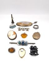 A collection of antique and costume jewellery, including a amber glass swivel fob, a silver and