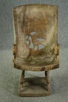 † An Ashanti carved hardwood lion throne chair. H.92 W.48 D.50cm.