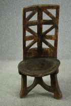 † An Ethiopian three legged Prestige Chair. H.118 W.56 D.56cm.