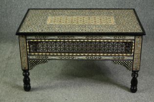 † A Damascus coffee table, with sedeli inlaid decoration, circa 1900. H.52 W.92 D.58cm.