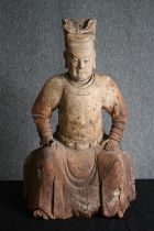 † A 19th century carved Chinese figure of a dignitary in traditional robes. H.77cm.