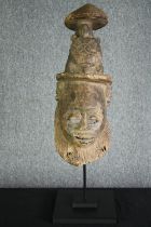 † Tribal African carved mask, Lwalu, West Kasai, Zaire. The top depicting a tortoise on a