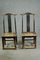 † A pair of 19th century Chinese elm yoke back chairs. H.126 W.53 D.43cm. (each).