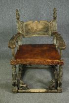 † A Chokwe carved hardwood throne chair with a leather seat. H.105 W.75 D.69cm.