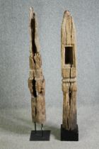 † Two 19th century Thai carved stupas/ancestor poles mounted on stands. H.133cm. (each).