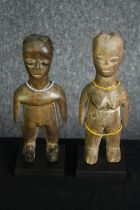 † Two carved African tribal figures, Lobi people, Burkina Faso. H.23cm. (each).