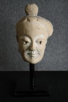 † A 19th century Chinese ceramic head from the Sichuan province. H.47cm.