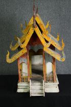 † A carved and painted Thai spirit house. H.90 W.54 D.80cm.