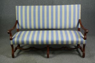 A William and Mary style walnut settee, early 20th century, with later striped upholstery. H.106 W.