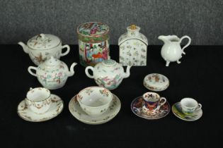 A group of various porcelain, including Cantonese Famille Rose lidded tobacco jar, tea pots and a