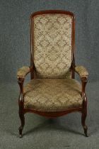 A late Victorian walnut open armchair. H.112cm.