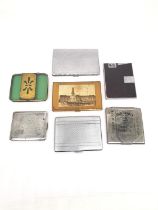 A collection of seven cigarette cases, including Jack Daniels, and early plastic and brass case, a