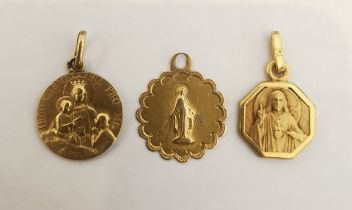 Three St Christopher's, a yellow metal (tests as 18ct) St Christopher with engraved virgin Mary