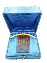 An antique cased French 18ct yellow gold pearl set hair comb. The gold arched top with a brushed