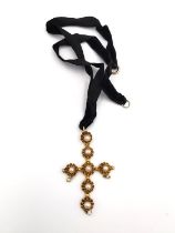 An early 20th century French 18ct yellow gold pearl set cross pendant, set with seven round white