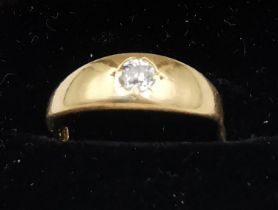 A Victorian 18ct yellow gold and old mine diamond ring. Set with a round old mine diamond with an