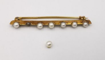 A French antique pearl set 18ct yellow gold bar brooch, set with seven round white pearls (one