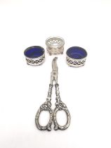 Three sterling silver open salts with blue glass liners (one odd fitting liner)and a pair of