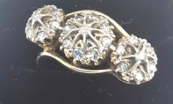 A Victorian 18ct yellow gold and old cut diamond triple cluster crossover ring, set with twenty