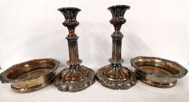 A pair of 18th century Sheffield plate candlesticks and a pair of similar wine coasters.