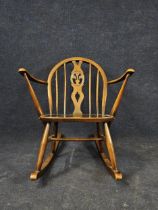 An Ercol Golden Dawn elm and beech child's rocking chair