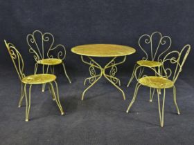 A set of weathered green painted metal garden furniture, including a breakfast table and 4