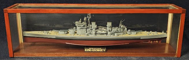 A ship's model of the King George V battleship, in a perspex show case