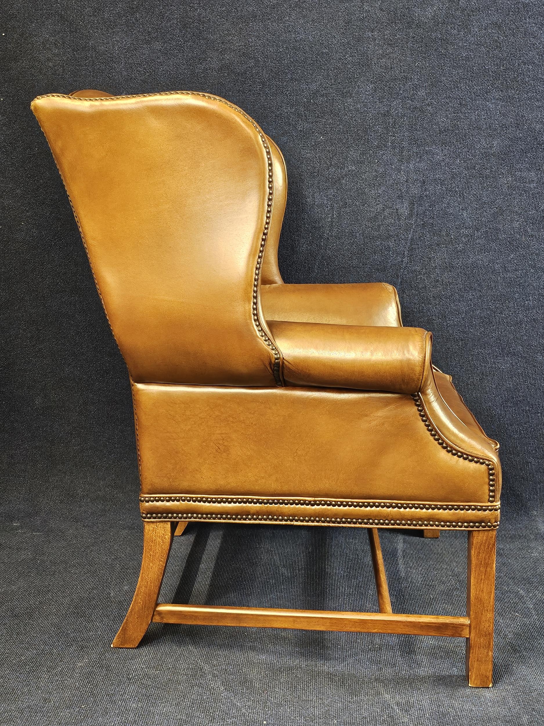 A George III style oak wingback armchair, with studded tan leather upholstery, 20th century. - Image 3 of 5