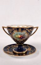 An early 20th century Royal Worcester hand painted twin handled cup with fruit design, royal blue