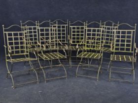 A set of eight bent steel garden chairs.