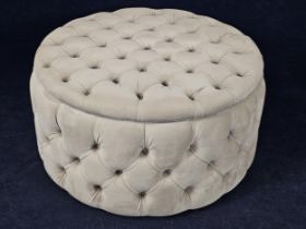 A large contemporary footstool, with ivory buttoned upholstery. H.44 W.84 D.84cm.