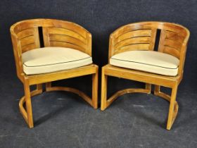 A pair of Art Deco style teak garden or conservatory tub chairs, with piped white upholstery. H.55