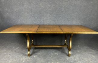 A mid 20th century teak extending dining table by Younger H.74 W.158 D.91cm Extended W.218cm