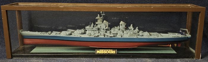 A ship's model of the US Battleship Missouri, in a perspex show case. H.22.5 W.82 D.15cm.