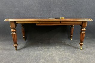 A William IV style mahogany wind-out extending dining table with one extra leaf. H.78 W.150 (