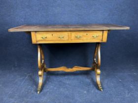 A Regency style walnut and crossbanded sofa table, circa 1900. H.75.5 W.81 D.51cm Extended 120.5cm