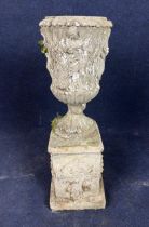 A weathered composition stone garden urn on pedestal base. H.77 Dia.25cm.