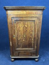 A George III oak corner cupboard H.130 W.84 D.48.5cm