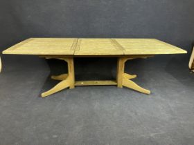 A weathered teak extendable garden dining table. H.74 W.170 D.110cm Extended W.230cm