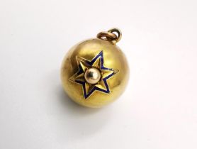 A Victorian yellow metal (tests as higher than 9ct) ball pendant with raised star design inlaid with