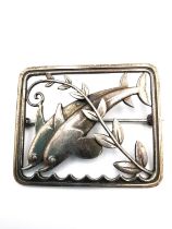 A silver double dolphin brooch designed by Arno Malinowski for Georg Jensen, No. 251. Makers mark to