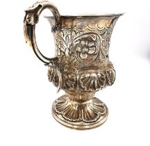 A Georgian silver christening cup by Charles Reily & George Storer, decorated with repoussé shell