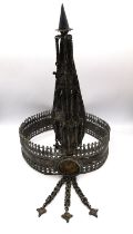 An early 20th century white metal (tests as silver) tribal crown with pierced design, removable leaf