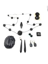 A collection of Jet and black glass jewellery, including a Victorian carved jet floral bead chain