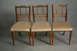 A set of three Edwardian walnut side chairs