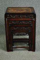 A set of Chinese carved hardwood quartetto tables, early 20th century. H.71 W.50 D.36cm.