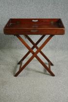 A George III mahogany butlers tray and stand. H.77 W.76 D.51cm.