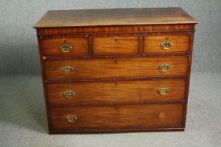 A George III mahogany and crossbanded chest, circa 1780 (missing feet, some loose mouldings as
