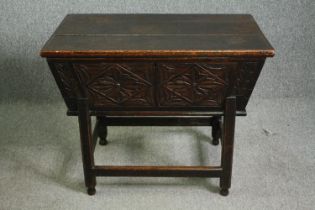 A 17th century style carved oak dough bin, 19th century. H.74 W.88 D.59cm.